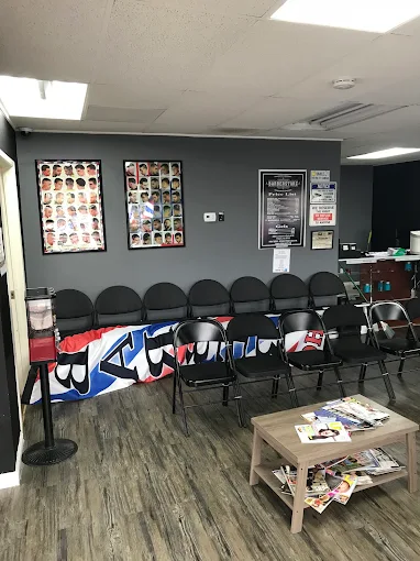 Waiting area with haircut style boards at BarberStarz Barbershop Clinton and Chestnut